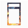 A rectangular decorative plate or frame with rounded corners, featuring an anime-style illustration of a fiery city scene. The design shows orange and yellow flames at the bottom, a dark blue night sky with embers, and a building silhouette in the background.