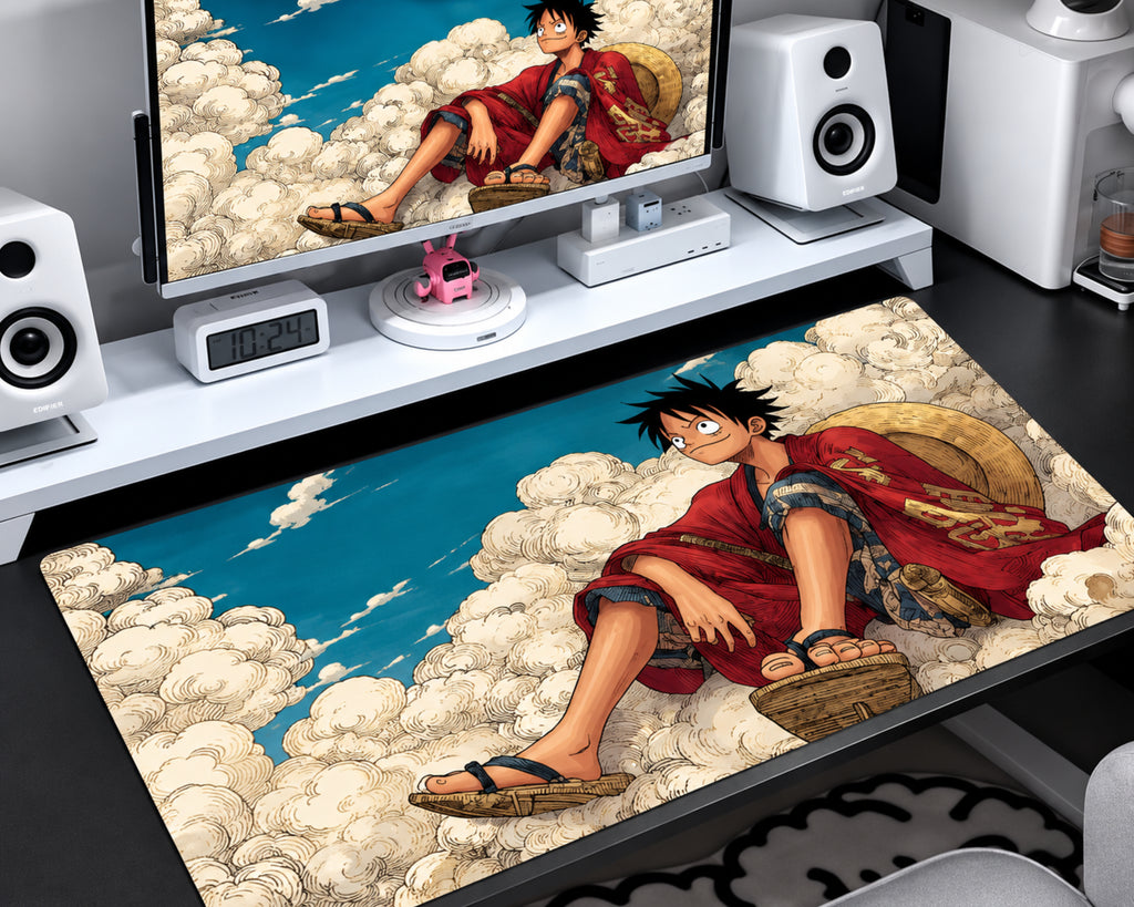 Extended gaming mouse pad featuring an anime straw-hat pirate in a red outfit seated among detailed cream-colored clouds beneath a vibrant blue sky.
