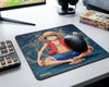 One Piece Luffy anime mouse pad in modern gaming desk setup with RGB accessories, manga books, and gaming headset