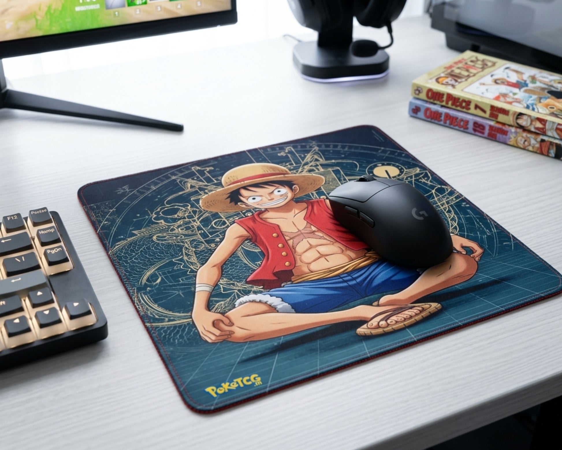 One Piece Luffy anime mouse pad in modern gaming desk setup with RGB accessories, manga books, and gaming headset