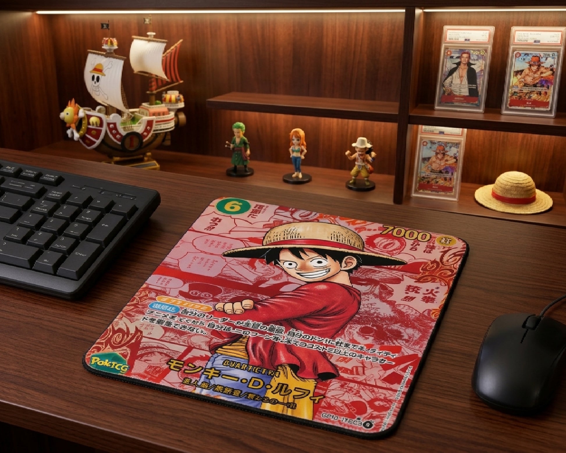 Monkey D. Luffy anime trading card style mouse pad displayed on a premium wooden desk with One Piece collectibles, figurines, graded cards, and gaming setup decor