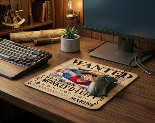 Monkey D. Luffy wanted poster anime mouse pad on wooden gaming desk with RGB mechanical keyboard, widescreen monitor, pirate themed decor, and modern anime workstation aesthetic