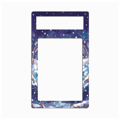 A rectangular decorative frame or border with a snow-covered mountain landscape print in blue, white, and purple tones, shown on a plain light gray background.