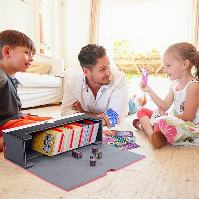 Man and two children playing with a card game on the floor.
