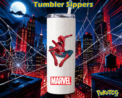 A white insulated tumbler with a clear lid and straw, featuring a Spider-Man graphic and the Marvel logo, set against a stylized red and blue city skyline at night with web silhouettes. Text at the top reads 'Tumbler Sippers' and a PokéTCG.
