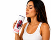 A woman in a white ribbed tank top holds a white Marvel-branded tumbler with a Spider-Man graphic and a clear straw against a plain white background.
