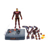 Toy figure of Iron Man with accessories on a white background