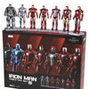 Collection of Iron Man action figures in various suits on a display stand with packaging.
