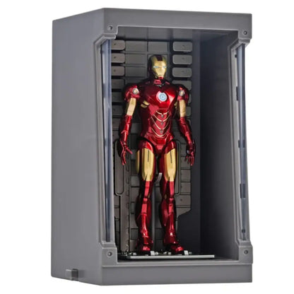 Red and gold superhero figure in a gray display case on a white background