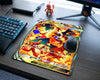 Mega Charizard Y Pokémon card style gaming mouse pad with fiery artwork placed on a modern gaming desk setup with RGB keyboard and wireless mouse