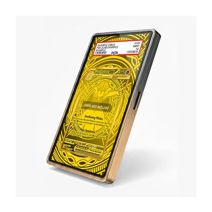 A gold-plated smartphone case shown at an angle on a light gray background. The screen displays a yellow and black Pokémon trading card design mockup, and a PSA authentication sticker is visible at the top of the screen.