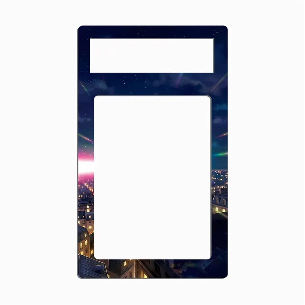 A decorative phone case or frame insert with a large blank white center and a smaller blank white top section, bordered by a dark night-sky and cityscape print with stars, colorful nebulae, and glowing windows.