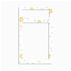 A white rectangular desk mat or planner pad with rounded corners, featuring a thin black border and a pattern of small pastel paperclip and star doodles in yellow, pink, blue, and orange.