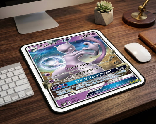 Mewtwo GX Pokémon trading card inspired mouse pad on a wooden desk setup with iMac, white keyboard, wireless mouse, and modern workspace aesthetic