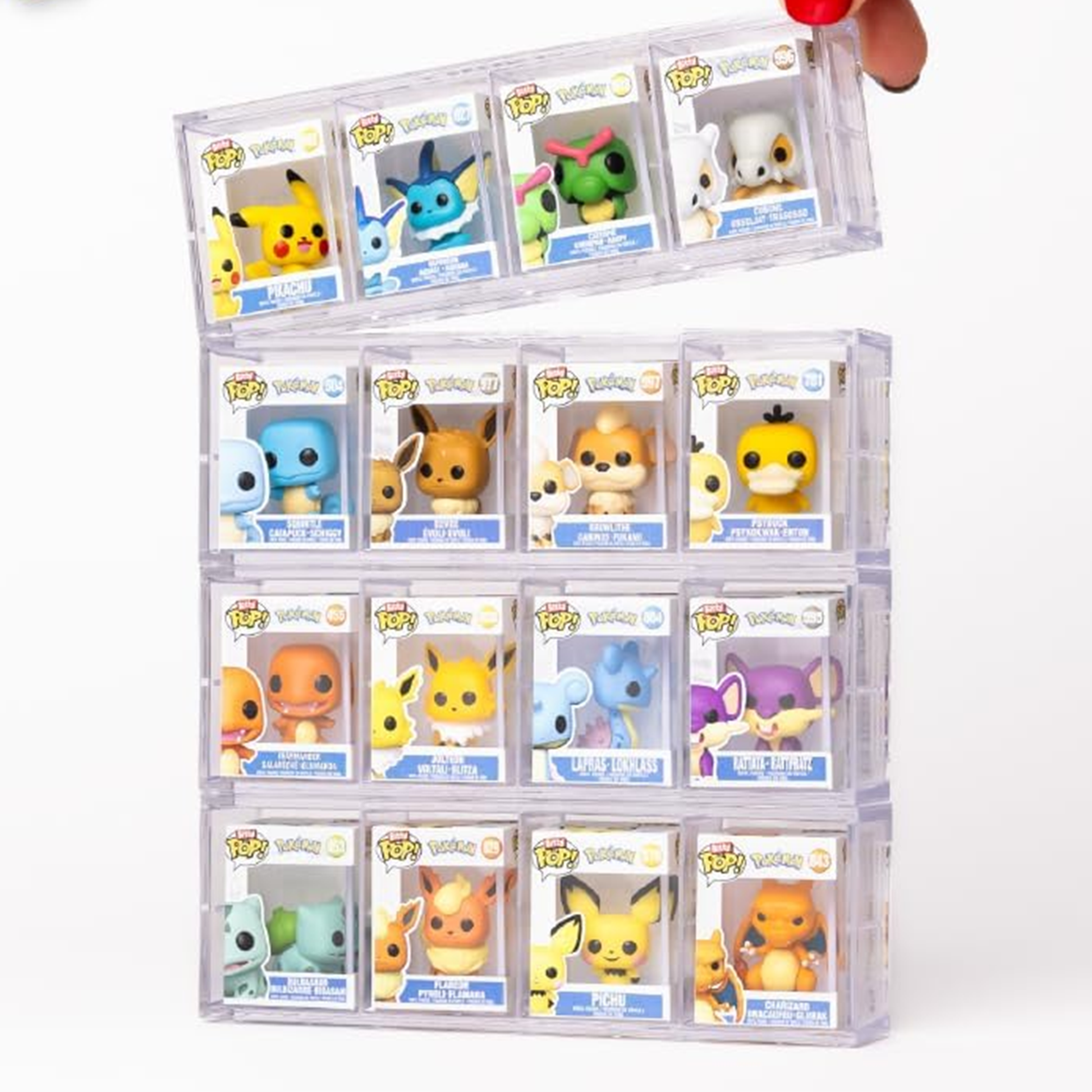 Collection of small figurines in transparent display cases on a white background
