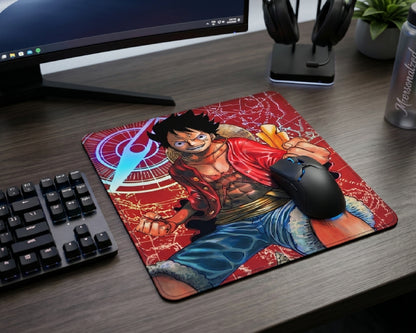 Red themed Monkey D. Luffy anime mouse pad displayed on a clean gaming desk with wireless gaming mouse, mechanical keyboard, and headphone stand