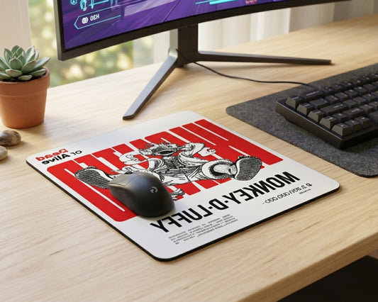 Stylish Monkey D. Luffy wanted poster themed anime mouse pad with bold red typography, placed on a minimalist gaming desk beside mechanical keyboard and widescreen monitor
