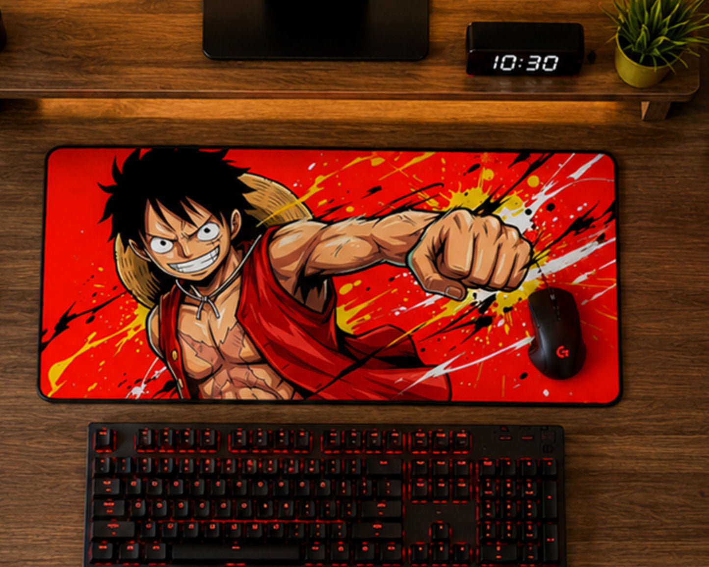 A large rectangular desk mat featuring an anime character on a red splattered background, styled on a wooden desk above a keyboard and mouse.