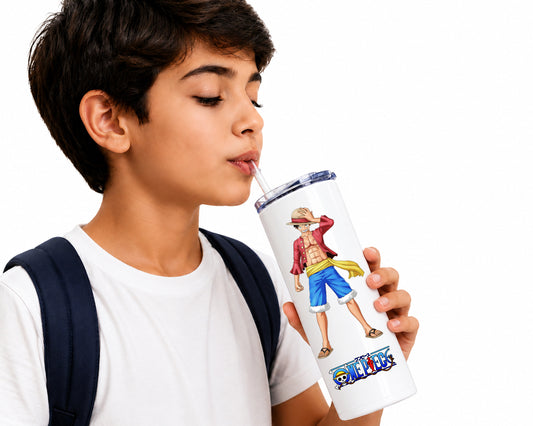 A young boy with a white t-shirt and dark backpack strap drinking from a white insulated tumbler with a straw. The tumbler features a colorful illustration of the character Monkey D.