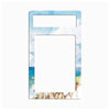 A rectangular magnetic money clip with a watercolor beach print featuring blue sky, ocean, and palm trees, shown on a plain white background.