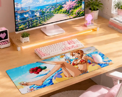 A large anime-themed desk mat featuring Aisle of Shame from My Dress-Up Darling, styled on a light wood desk next to a keyboard, monitor, and desk accessories.