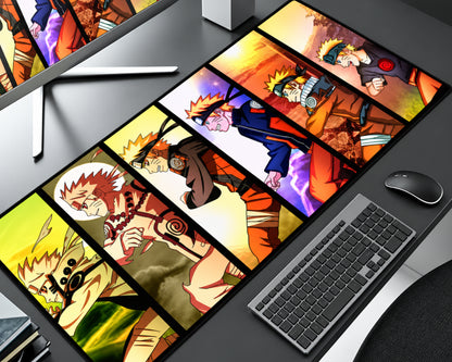 Naruto Uzumaki extended anime gaming mouse pad featuring multiple character panels with blond spiky hair, orange ninja outfits, golden chakra-inspired transformations, fiery sunset backgrounds, purple energy effects, and bold black dividers, displayed on a gray computer desk beside a black keyboard and mouse.