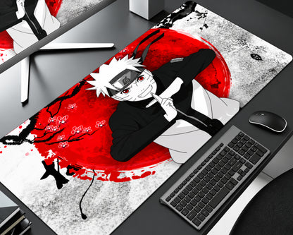 Naruto Uzumaki anime gaming mouse pad featuring white spiky hair, red eyes, a Leaf Village forehead protector, black clothing, and a ninja hand-sign pose over a bold red sun with cherry blossoms and black ink artwork.