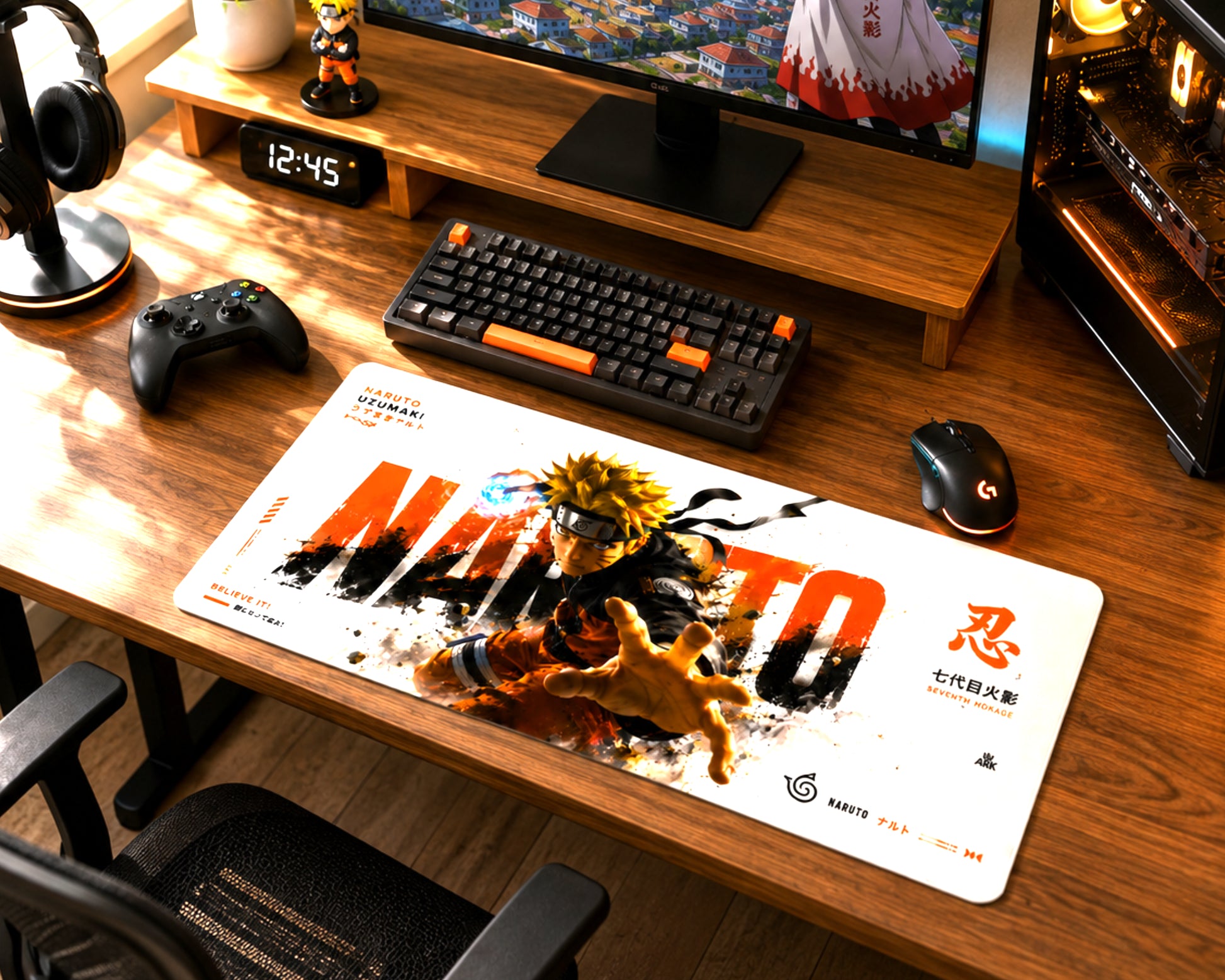 A large desk mat featuring Naruto anime artwork and the word 'NARUTO' is laid out on a wooden desk in a gaming setup, surrounded by a keyboard, mouse, controller, headphones, and monitor.