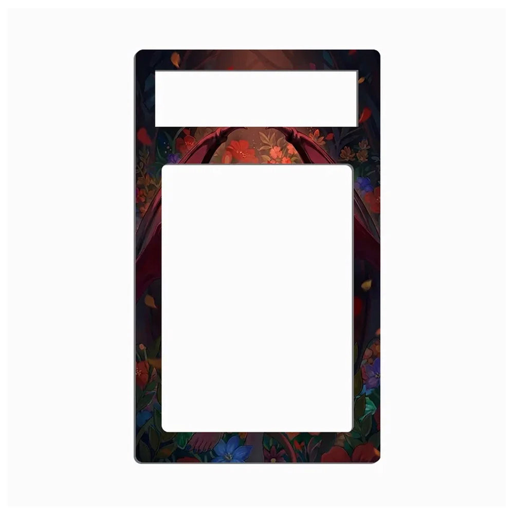 A decorative double-slot card holder or picture frame with a dark, ornate floral border. The top slot is blank, while the larger bottom slot features a colorful, detailed border with red, blue, and green floral patterns on a black background.