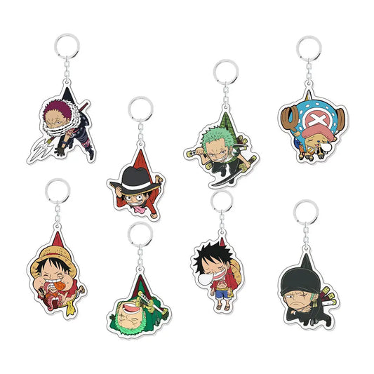 Set of eight chibi anime keychains featuring characters from One Piece, each with a silver metal key ring and attached acrylic charm on a plain white background.