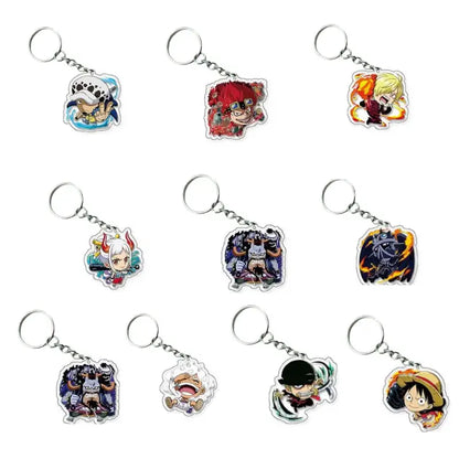 Nine anime keychains featuring characters from One Piece, arranged in a 3x3 grid on a plain white background. Each keychain has a silver metal split ring and a die-cut acrylic charm with colorful character illustrations.