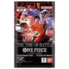Front of a One Piece Card Game booster pack package, showing anime artwork with Luffy, Zoro, and other characters, plus text including 'The Time of Battle,' 'One Piece Card Game,' '12-card Booster Pack,' and Bandai/Namco branding.