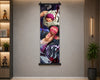 A vertical anime wall scroll poster featuring Roronoa Zoro from One Piece, hanging on a neutral gray wall in a modern room setting with shelves and a plant.