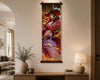 A vertical wall scroll art print featuring an anime-style warrior character, hanging on a beige wall in a modern living room setting with a console table, lamp, and vase.