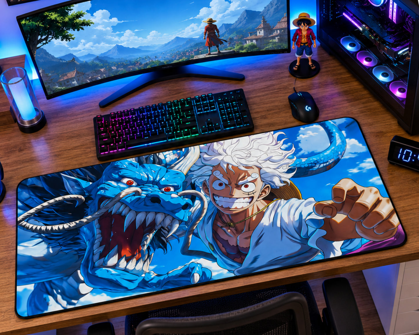 A large anime desk mat featuring Monkey D. Luffy and a blue dragon from One Piece, styled on a wooden desk alongside a curved monitor, keyboard, mouse, and PC tower.