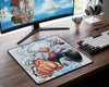 Gear 5 Monkey D. Luffy inspired anime mouse pad displayed on a clean gaming workstation with RGB keyboard, wireless gaming mouse, and One Piece ship wallpaper on monitor
