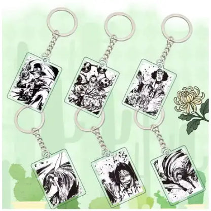 Six rectangular acrylic keychains with silver metal key rings and chains, each featuring black-and-white manga-style character illustrations, arranged on a pale green background with a white flower graphic.