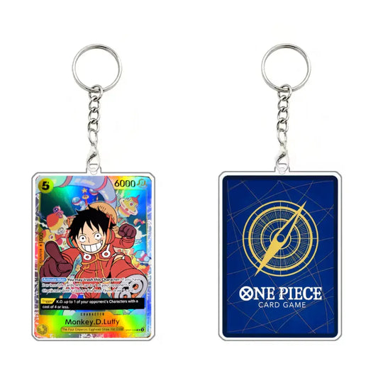 Two acrylic keychains representing the One Piece Card Game, showing the front holographic card design of Monkey D. Luffy and the back blue card with a gold compass graphic and 'ONE PIECE CARD GAME' text.