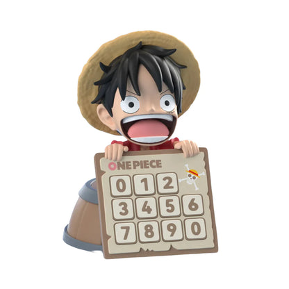 Figurine of a character from 'One Piece' holding a sign with numbers on a white background