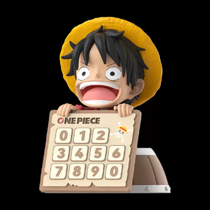Figurine of a character from 'One Piece' holding a wooden number board with numbers 0 to 9.