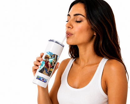 A woman with dark hair wearing a white ribbed tank top is shown from the side, drinking from a white insulated tumbler with a clear straw. The tumbler features a colorful graphic print of characters from The Legend of Zelda, including Zelda, Ganond, and the title 'LEGEND ZELDA', against a plain white background.