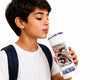A boy with short dark hair, wearing a white t-shirt and a navy backpack strap, holds a white stainless steel tumbler with a straw. The tumbler features a colorful graphic of the anime character Monkey D.