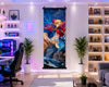 A large vertical wall scroll poster featuring a colorful anime-style illustration of a blonde female character in a red cape, displayed in a modern, well-lit gaming room with shelves, plants, and a desk.