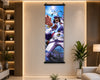 A vertical wall scroll poster featuring an anime character in a white and purple outfit with blue energy effects, displayed in a modern living room setting with wood slat walls, a shelf, and a plant.