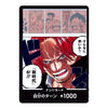 A collectible manga trading card featuring a close-up anime-style illustration of a red-haired character with Japanese text, plus small comic panels at the top. The card is centered on a plain white background.