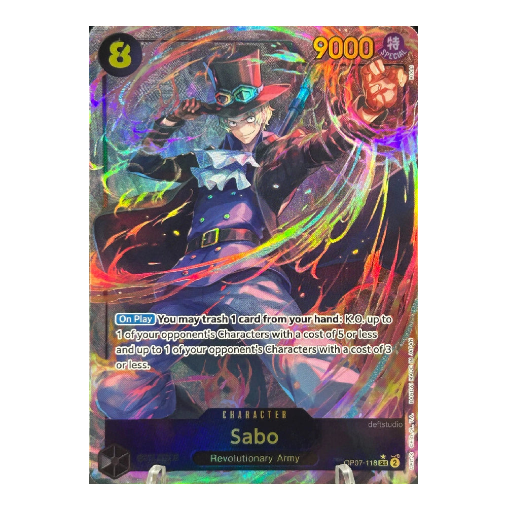 A holographic trading card featuring the character Sabo from Revolutionary Army, with a vibrant multicolor rainbow effect and Japanese text.