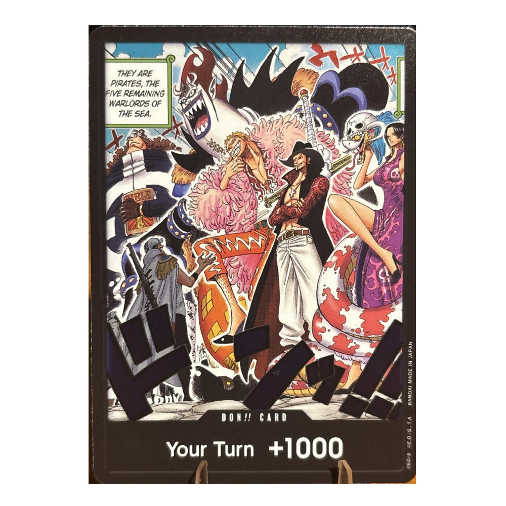 A One Piece trading card featuring a colorful anime illustration of the Pirate King and other sea warriors, with the text 'Your Turn +1000' at the bottom.