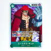 A trading card featuring the character Yustulard-Kidod from One Piece, with red hair, a large blue mechanical arm, and a dark outfit, shown on a white background.