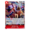 A Japanese Yu-Gi-Oh! trading card featuring X-Dracon, a blue dragon character, with artwork of him battling a white dragon. The card has a red border, a red top-left power icon, and a red bottom banner with the character name in Japanese.