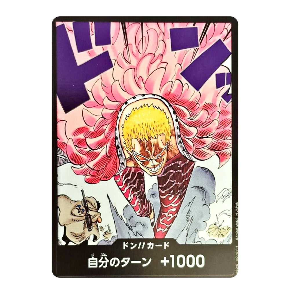 A collectible trading card featuring an illustration of Don Diego from One Piece with pink chrysanthemums, yellow hair, and a striped shirt, with Japanese text at the bottom.